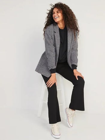 model wearing fleece-lined black flare leggings