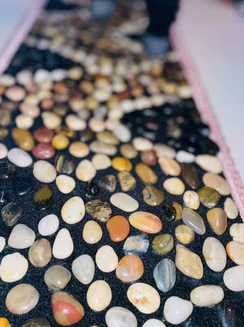 Close-up of a variety of pebble stones potentially for sale or design inspiration