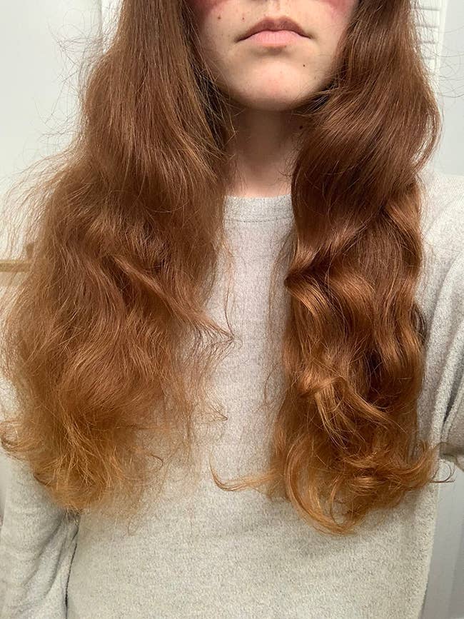Reviewer with long, wavy hairsbreadth wearing a cozy, airy sweater