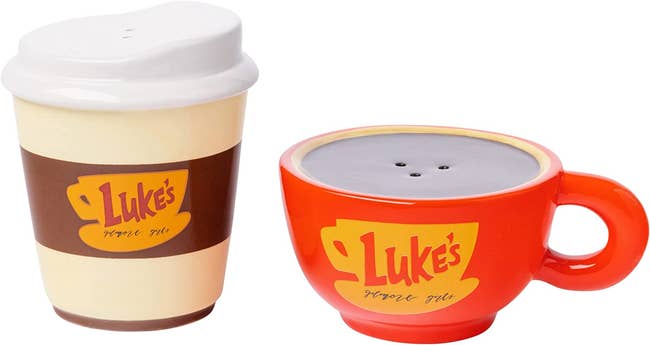 a to-go coffee cup and one red mug shaker that says 