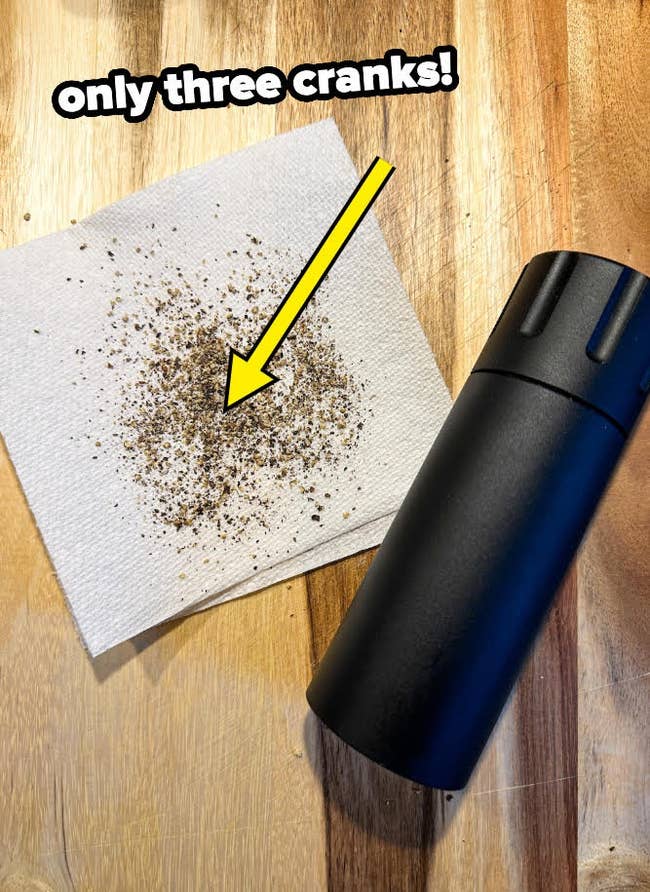 Pepper scattered on napkin next to grinder; text 