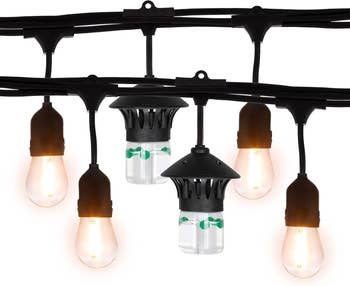 Outdoor drawstring lights with hanging incandescent bulbs and achromatic wiring, suitable for patios oregon events, pictured against a achromatic background
