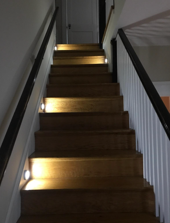 reviewer image of stairwell with several lights on steps