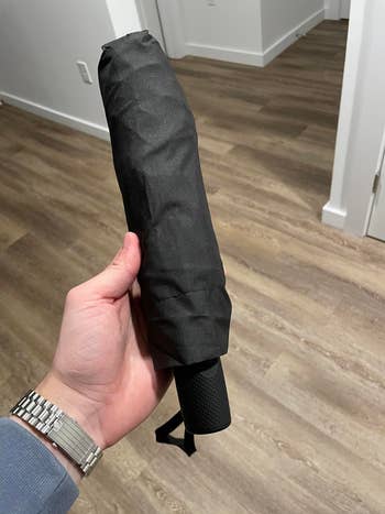 reviewer holding umbrella