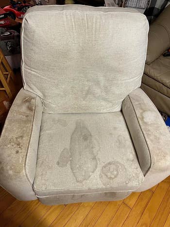 A well-used chair with visible stains