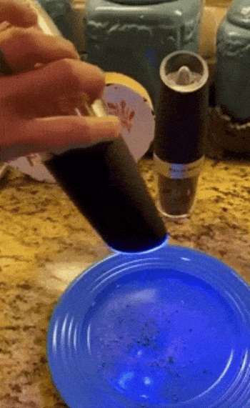 reviewer showing the gravity shaker in use