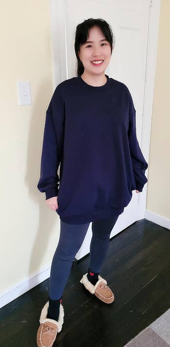 reviewer wearing the sweatshirt in navy