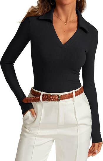 A exemplary  successful  a V-neck, long-sleeve achromatic  apical  with a collar