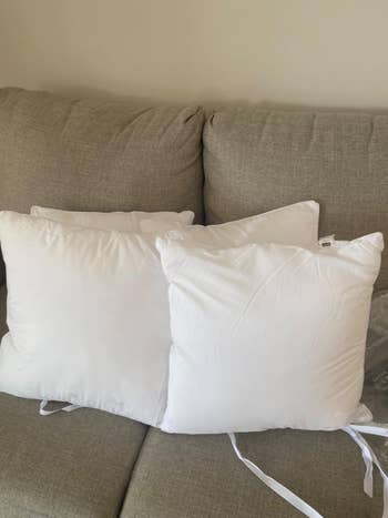 A reviewer's throw pillows without covers