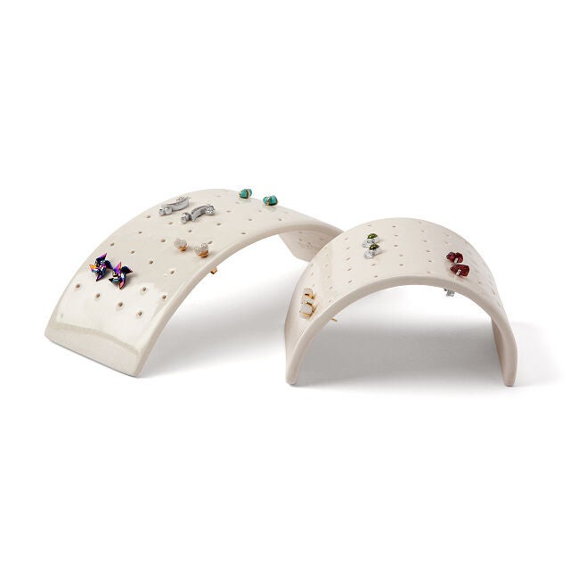 two arc-shaped stud earrings holders