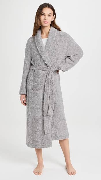 model in grey bathrobe
