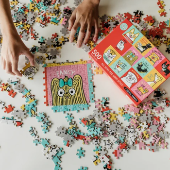 person assembling the puzzle