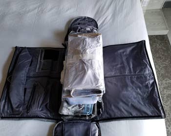 the same reviewer showing the open garment bag