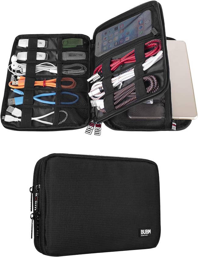 An electronics organizer with various compartments filled with cables and a laptop, ideal for travel or storage