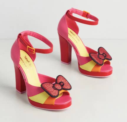 pink orange yellow and red color blocked platform heeled sandals with glittery red bow on strap