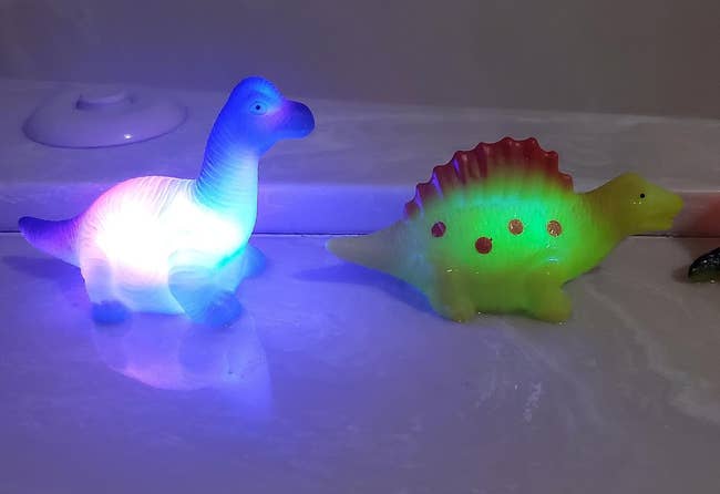 two light up dinosaur bath toys