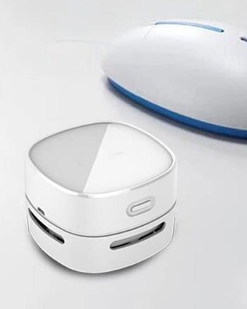 the white mini desktop vacuum