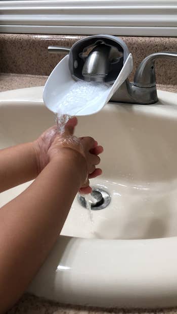 another reviewer's child washing their hands at the sink
