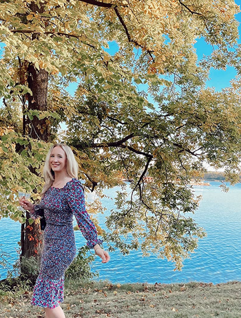 reviewer in the blue floral smocked dress