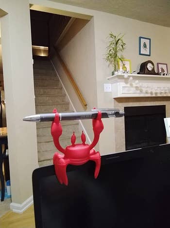 the crab holding a pen