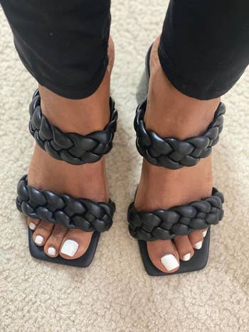 reviwer wearing black chunky braided sandals