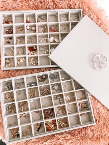 reviewer photo of two jewelry trays full of jewelry