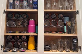 Organized room cupboard holding assorted tumblers and lids