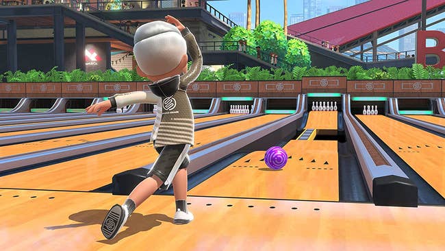 a character rolling a bowling ball in nintendo switch sports