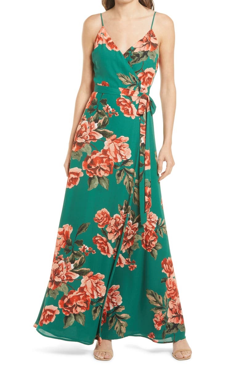 model in green maxi with large pink rose print