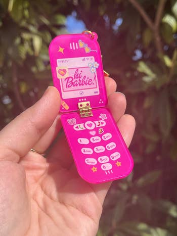 hot pink keyring flipped open to look like cell phone with hi barbie on screen