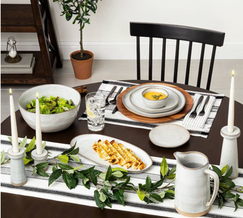 a table set with the grey stoneware dishes