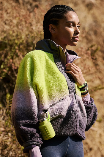 model wearing the green and purple ombre fleece jacket