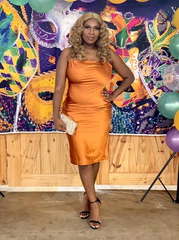 reviewer wearing the formal  successful  orange