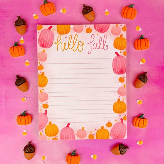 lined notepad with pink and orange pumpkins and text 