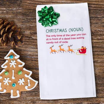 The dish towel with a funny definition of christmas