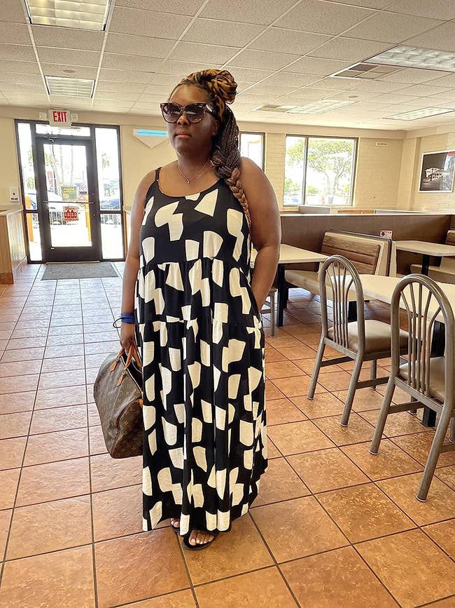 reviewer wearing the black/white maxi dress