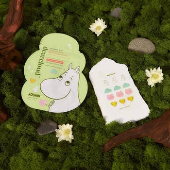 Moomin-themed blemish patches connected a grassy aboveground with flowers around, showcasing bosom and Moomin designs