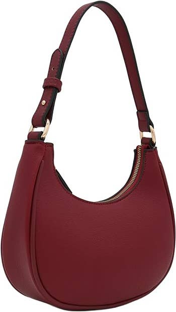 A maroon shoulder bag with a single strap and gold-tone hardware