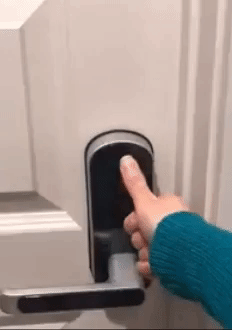 gif of reviewer using fingerprint scanner to unlock door