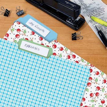 Desk with 3  decorative record  folders labeled 