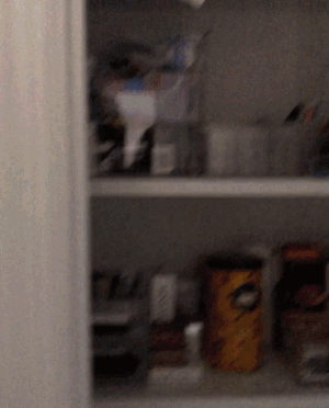 a gif of the buzzfeed editor opening the closet to show the light go on