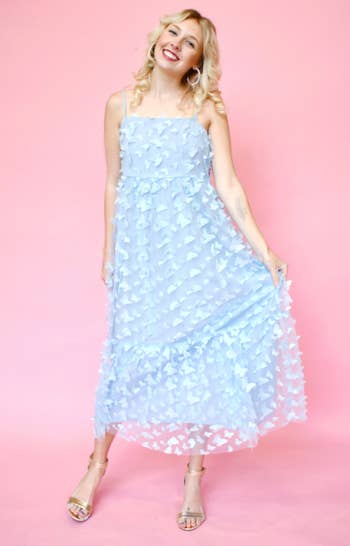 model in light blue tea-length dress