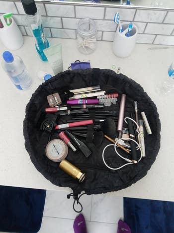 the makeup bag flat on a counter