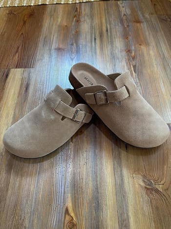 a reviewer's shoes in light brown 