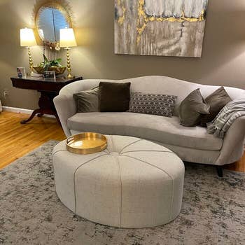 reviewer photo of ivory oval ottoman coffee table