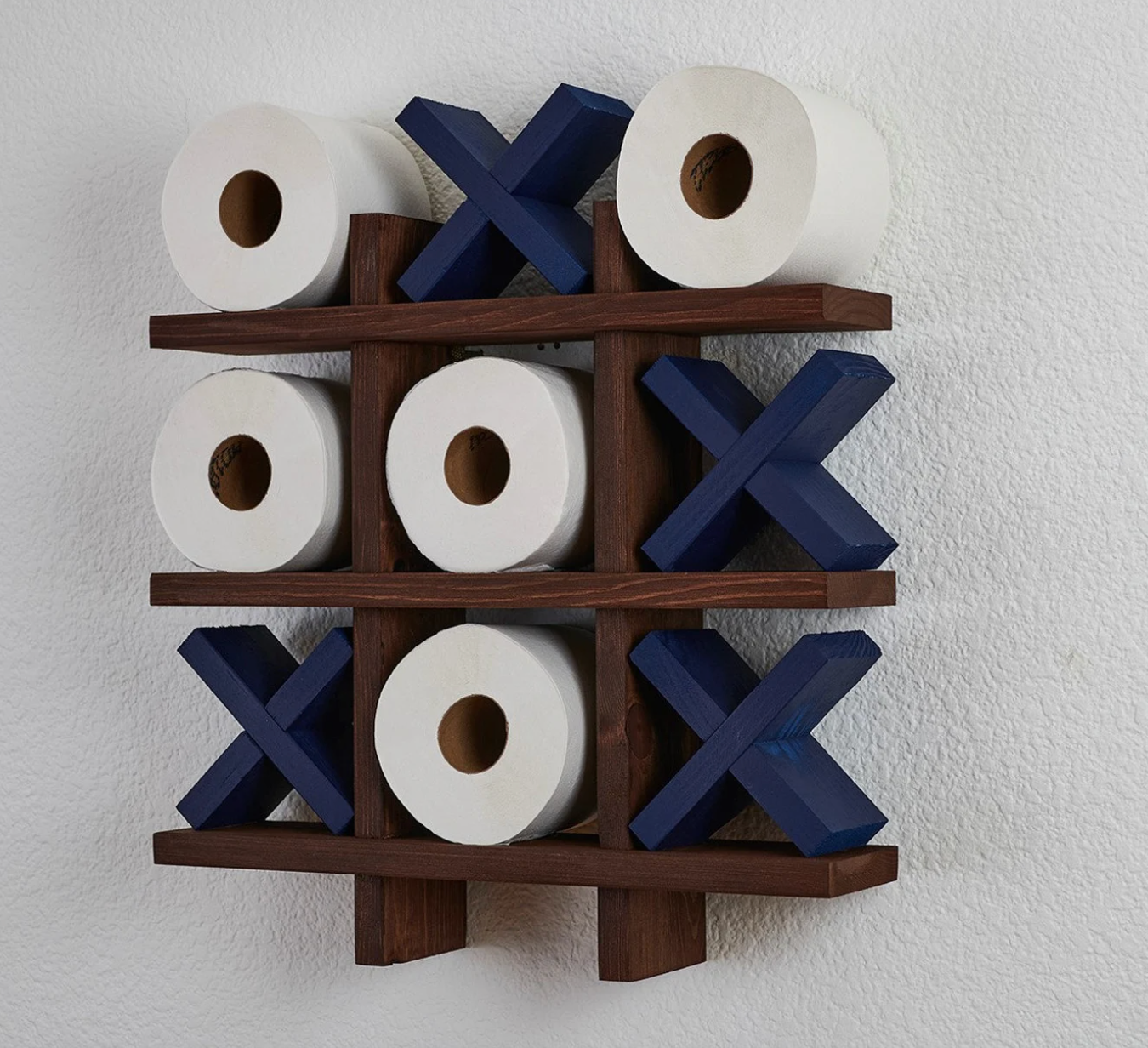 navy blue tic tac toilet roll holder mounted on a wall