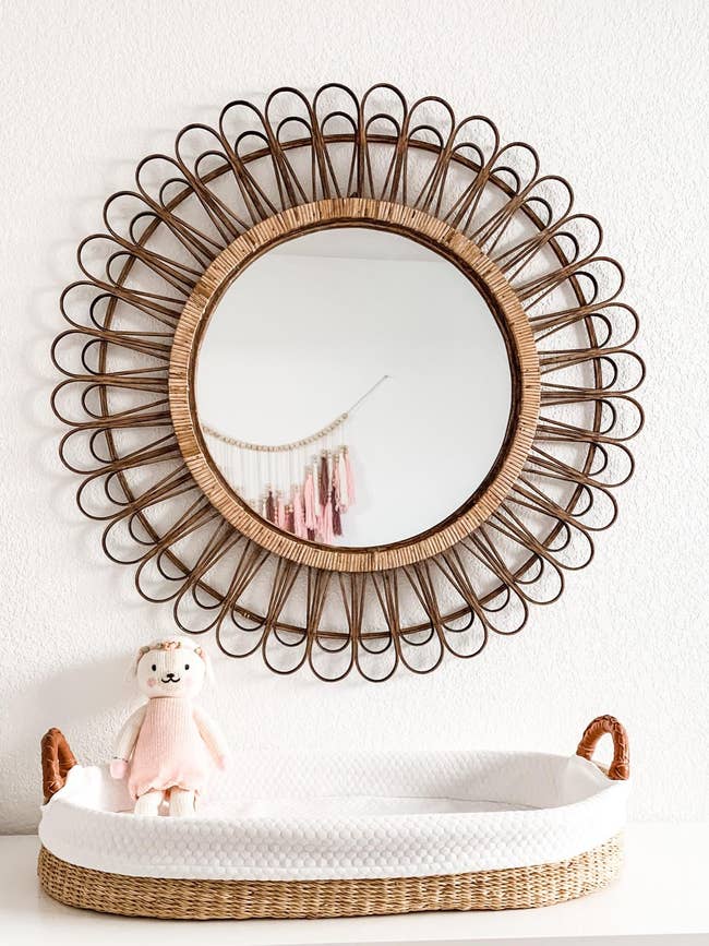 reviewer image of the mirror mounted on a wall in a nursery
