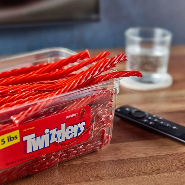 the bulk box of twizzlers on a coffee table