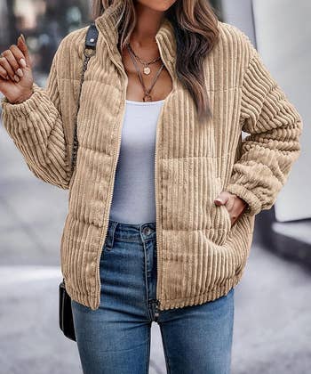 model in the khaki corduroy quilted bomber jacket with hand in pocket