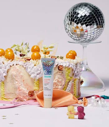 birthday balm dot com next to a cake and a disco ball